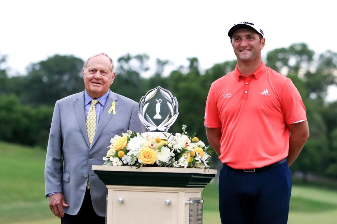 Jon Rahm, the best new golfer, receiving his trophy next to Jack Nicklaus