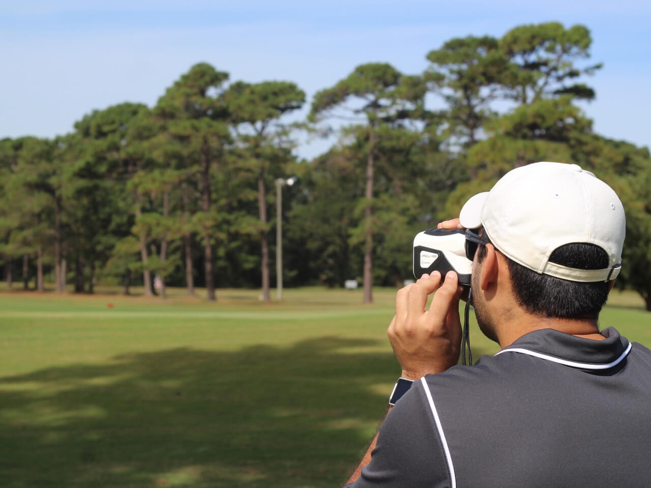 golf player with rangefinder