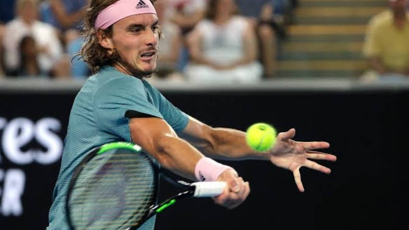 Stefanos Tsitsipas hitting the ball