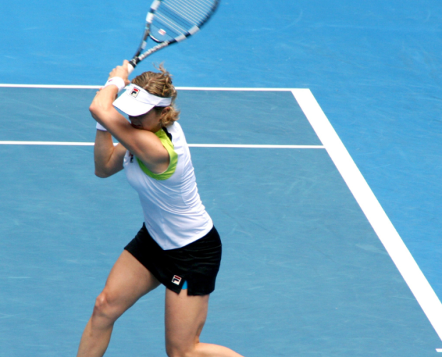 woman playing tennis to get WTA points